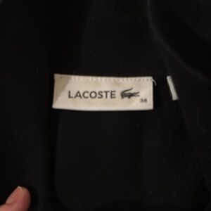 Lacoste knit sweater short sleeve collared top.
